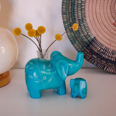 Two Colorful Blue Elephant Carved Statues from Kisii Kenya set in Kids Decor Scene